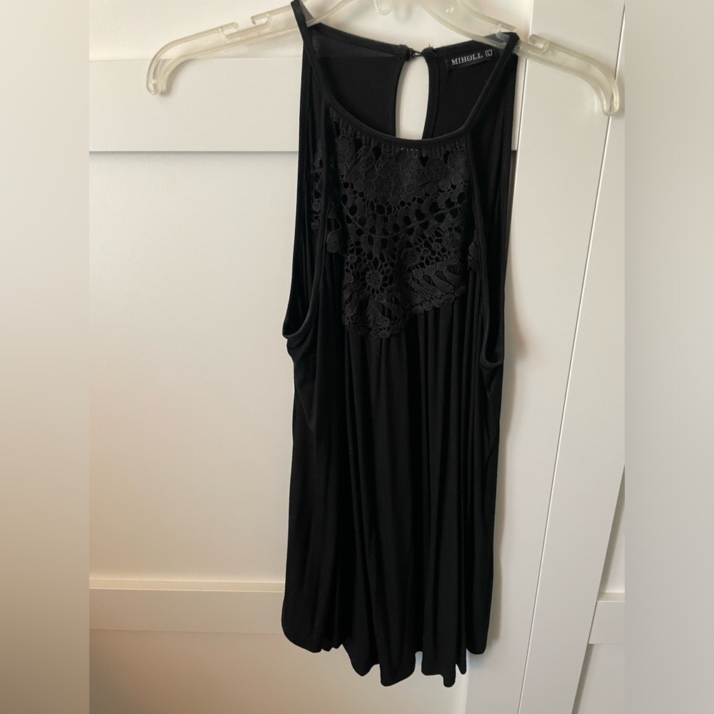 Black tank, with crochet detail. Flowy fit. Size Large
